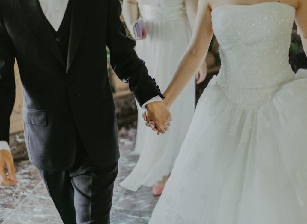 couple wearing tuxedo and wedding gown