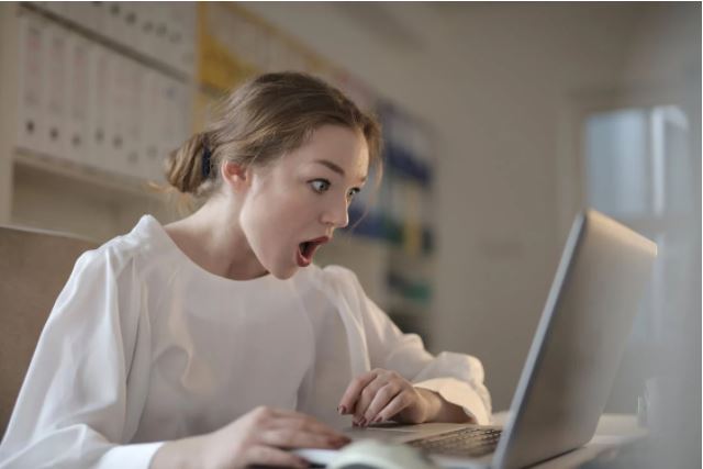 Girl shocked at something she was on her laptop