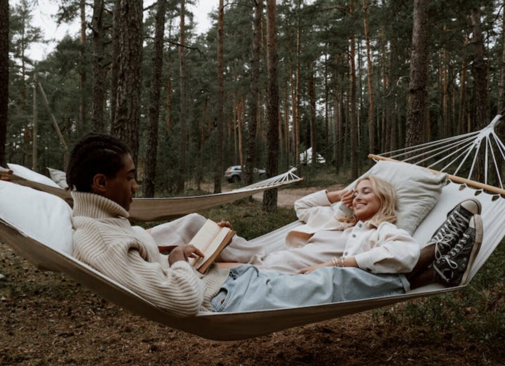 couple reading on a hammock